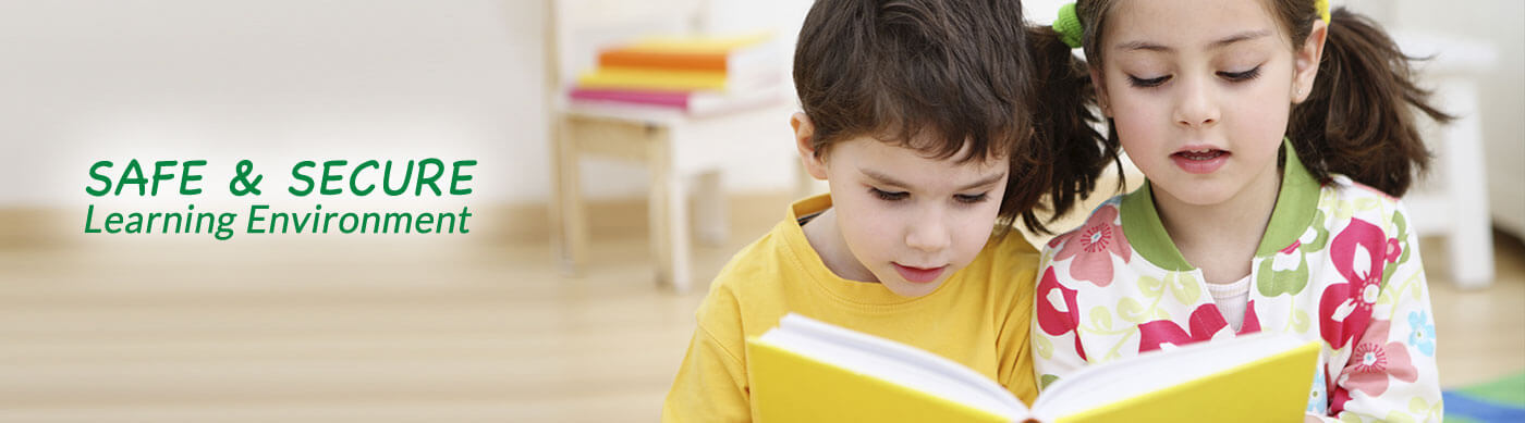 2 children reading a book with words - Safe & Secure Learning Environment